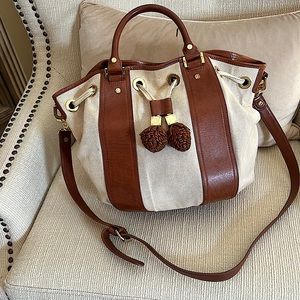 Tory Burch shoulder/Crossbody purse .Two tone with two gorgeous tassels.